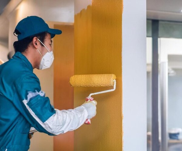 [freepicdownloader.com]-painters-applying-final-coats-paint-hotel-interior-walls-medium